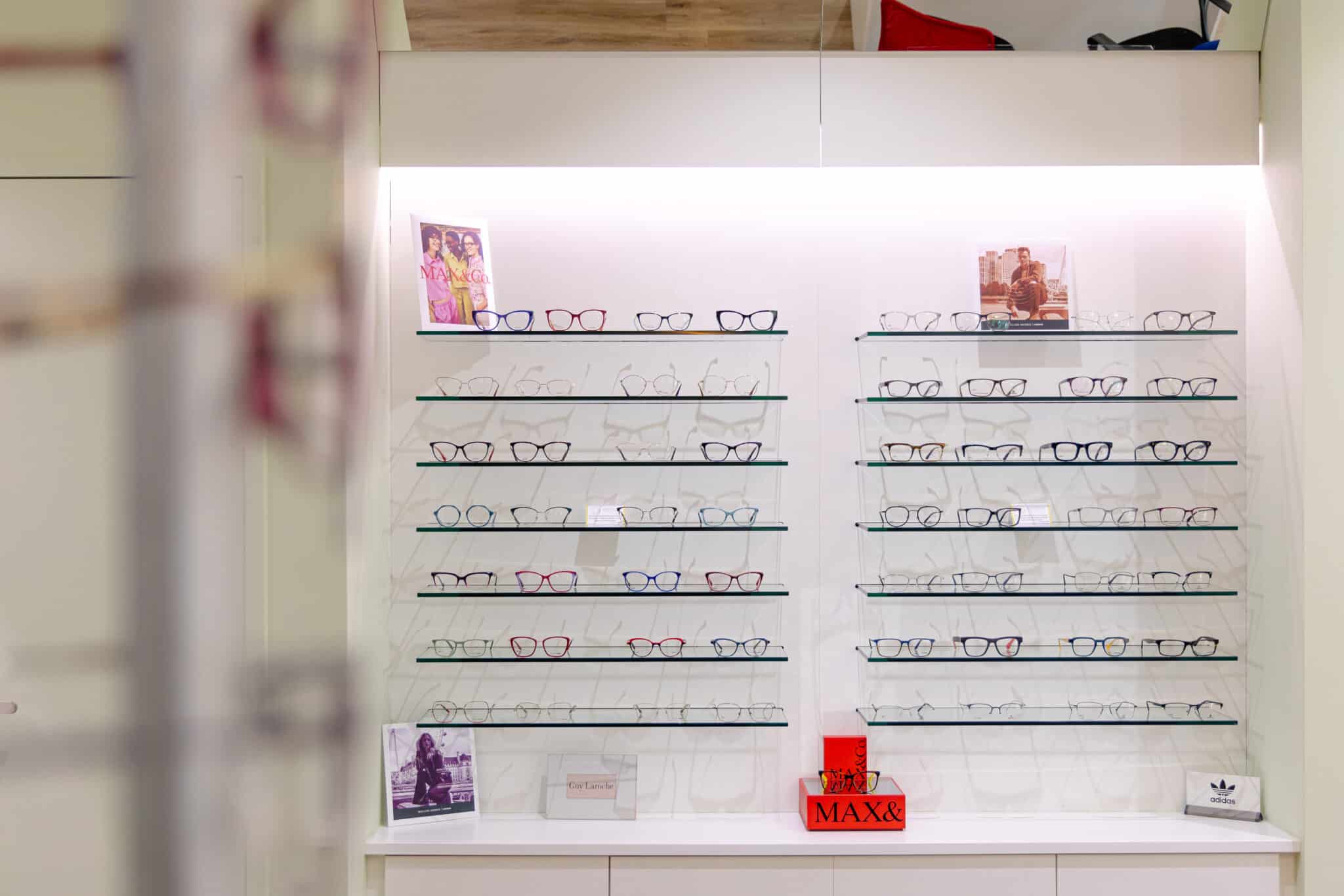 Frames displayed on the wall at Spectrum Family Eyecare